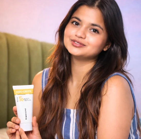 Creator holding a kids’ sunscreen to camera